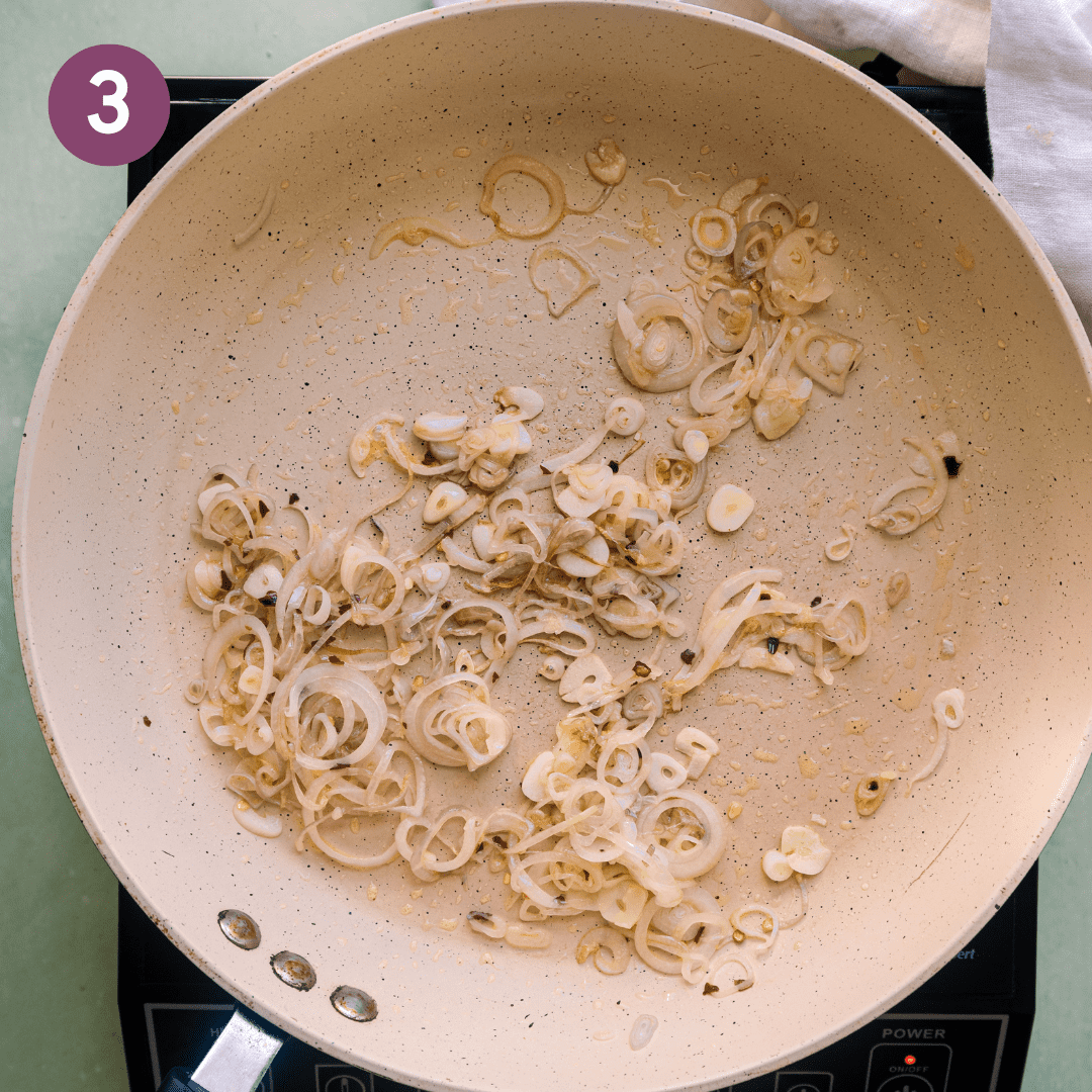 sauteing shallots, garlic and red pepper flakes in a frying pan.