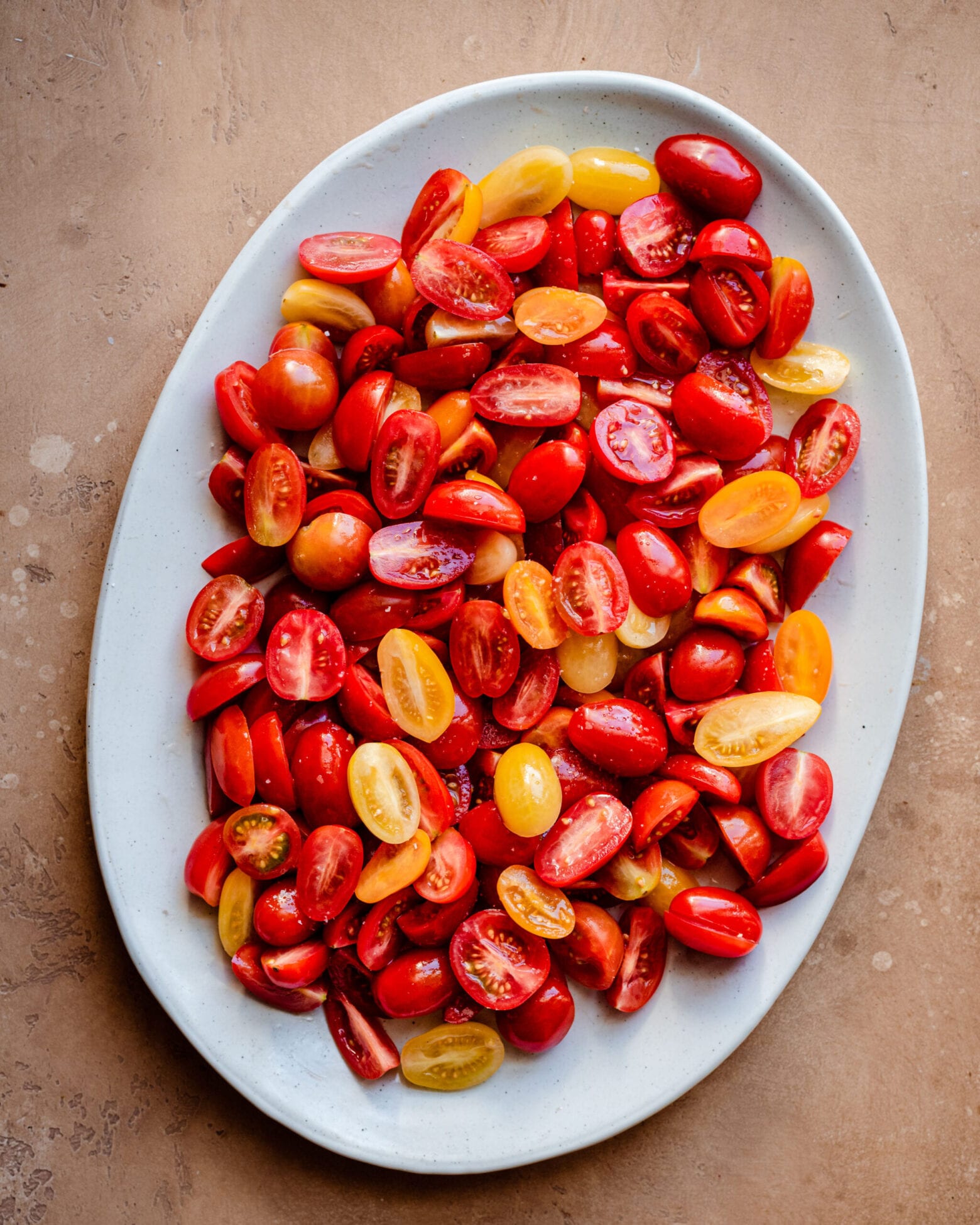 platter of sliced rainbow cherry tomatoes 