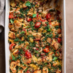 tomato and white bean casserole with spoon dug in