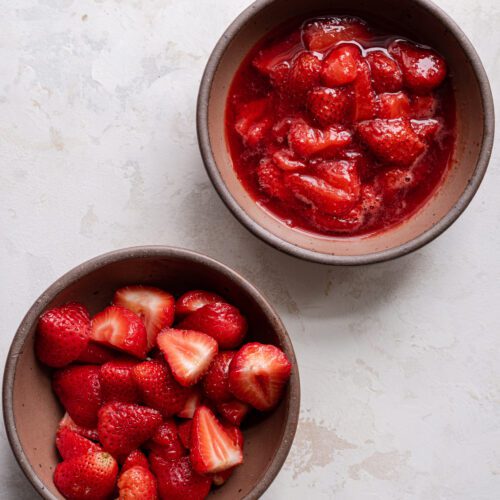 two bowls, one with strawberries, one with strawberry compote