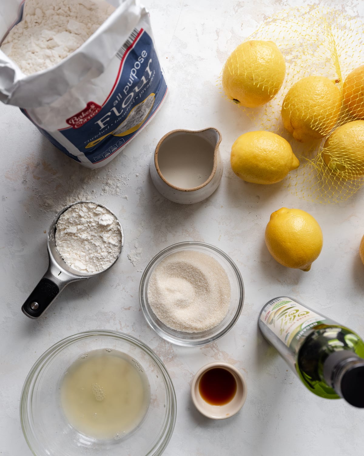 flatlay of baking ingredients for lemon olive oil cake