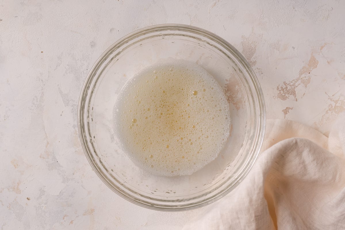 bowl of aquafaba on marble surface