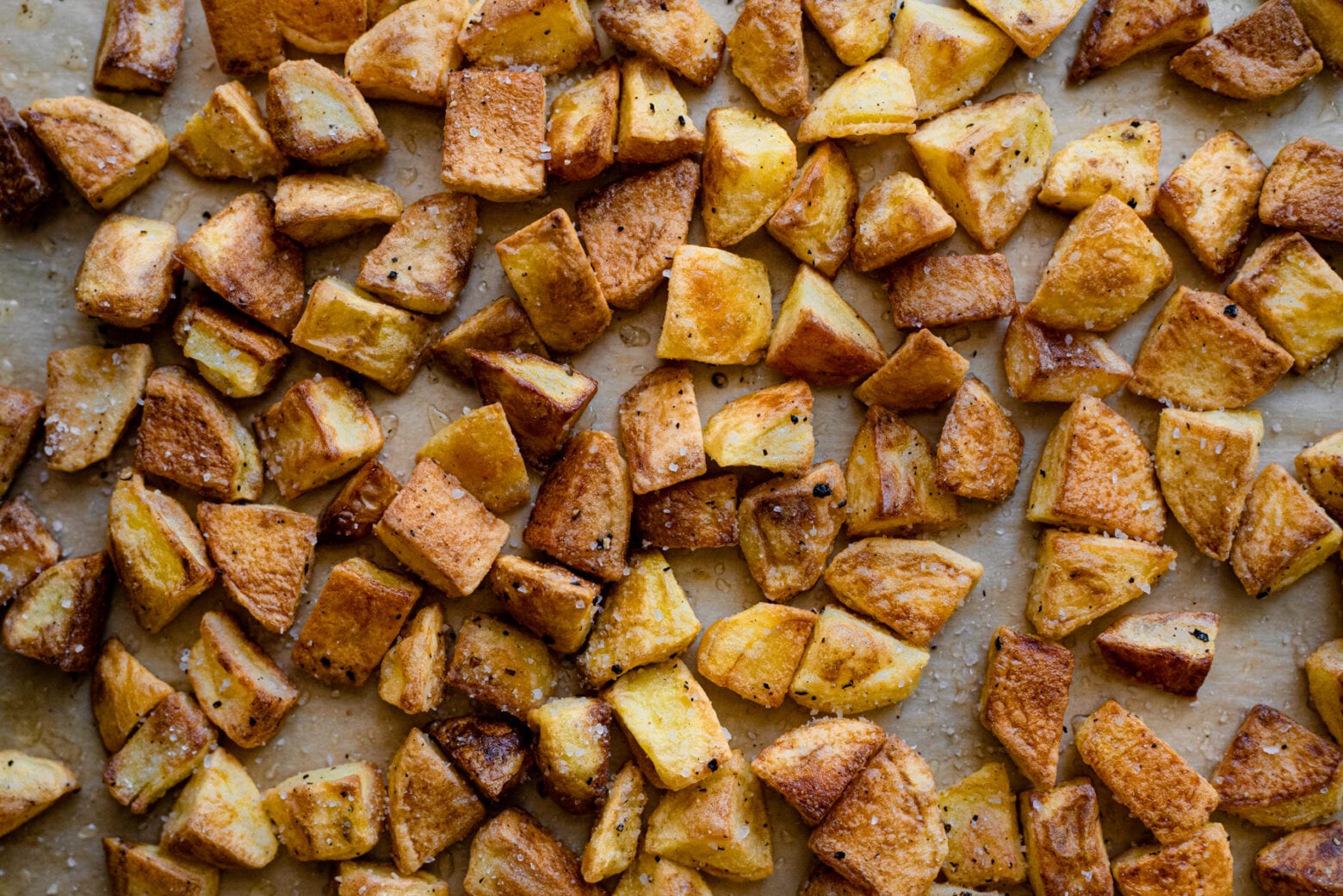 crispy golden roasted potatoes on baking sheet