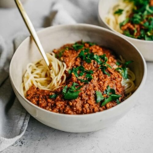2 bowls of spaghetti with vegan meat sauce