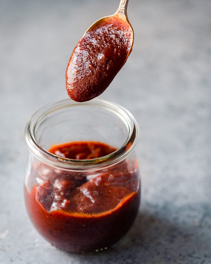 barbecue sauce coating a spoon