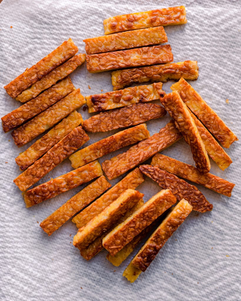 golden brown tempeh on paper towels