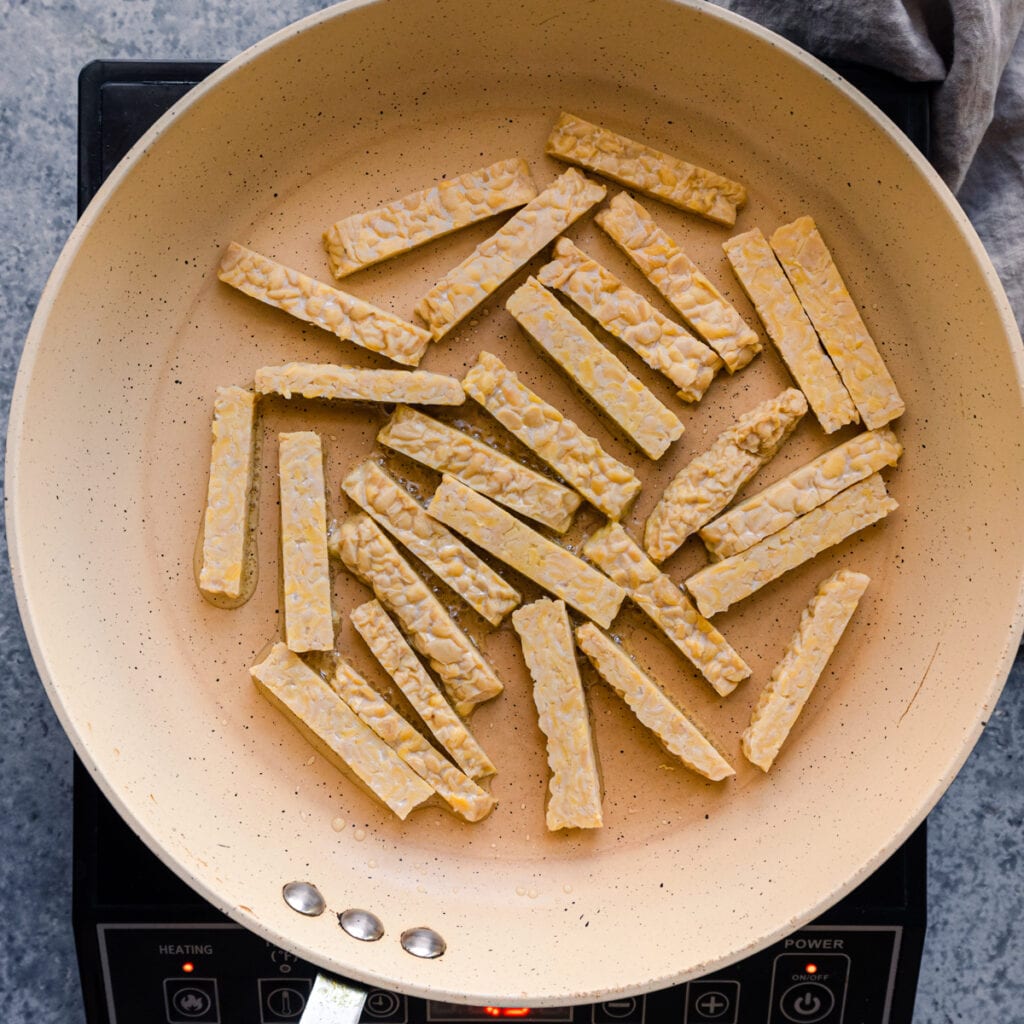 tempeh strips in frying pan