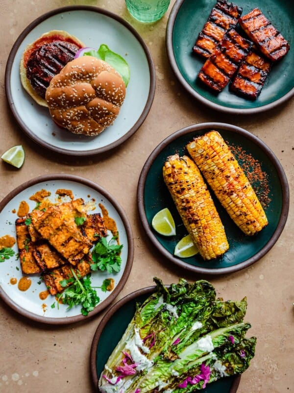 spread of vegan grilled food on a brown surface