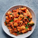 vegan pasta recipe with vegan sausage, marinara sauce, and spinach