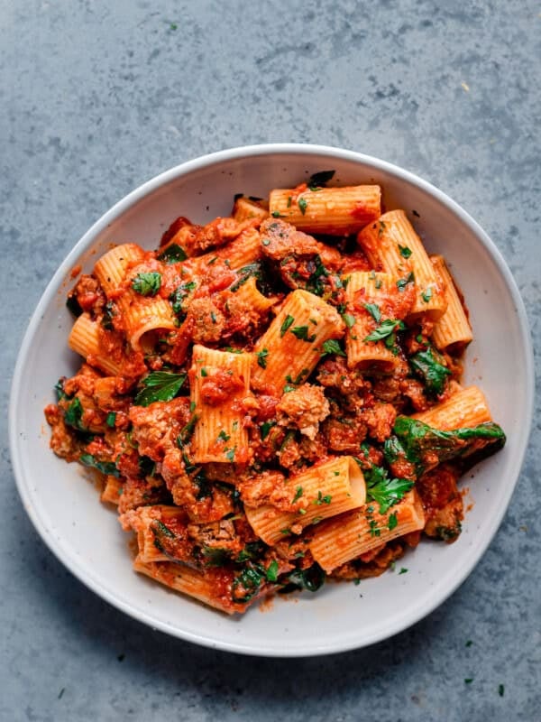 vegan pasta recipe with vegan sausage, marinara sauce, and spinach