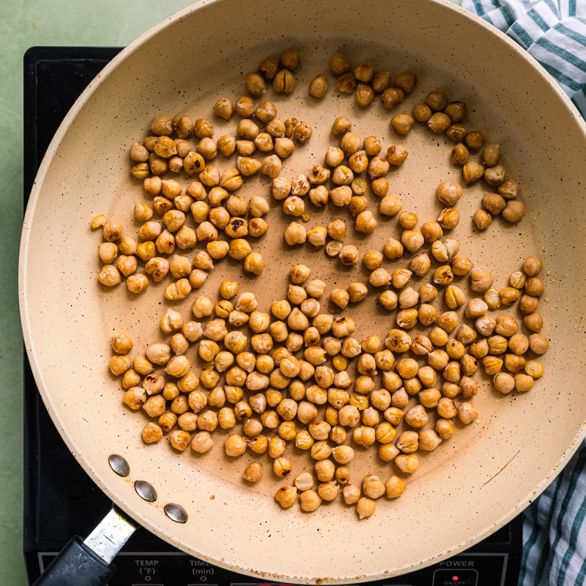 pan-frying chickpeas in a saute pan