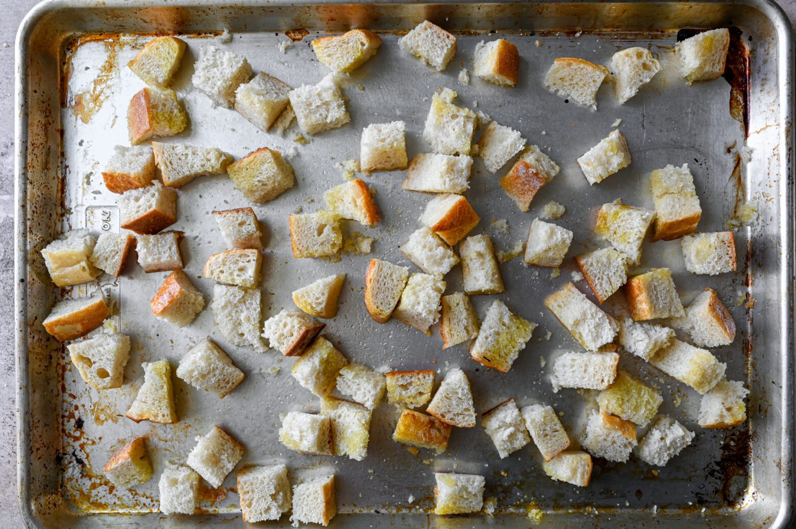 toasted bread cubes on baking sheet