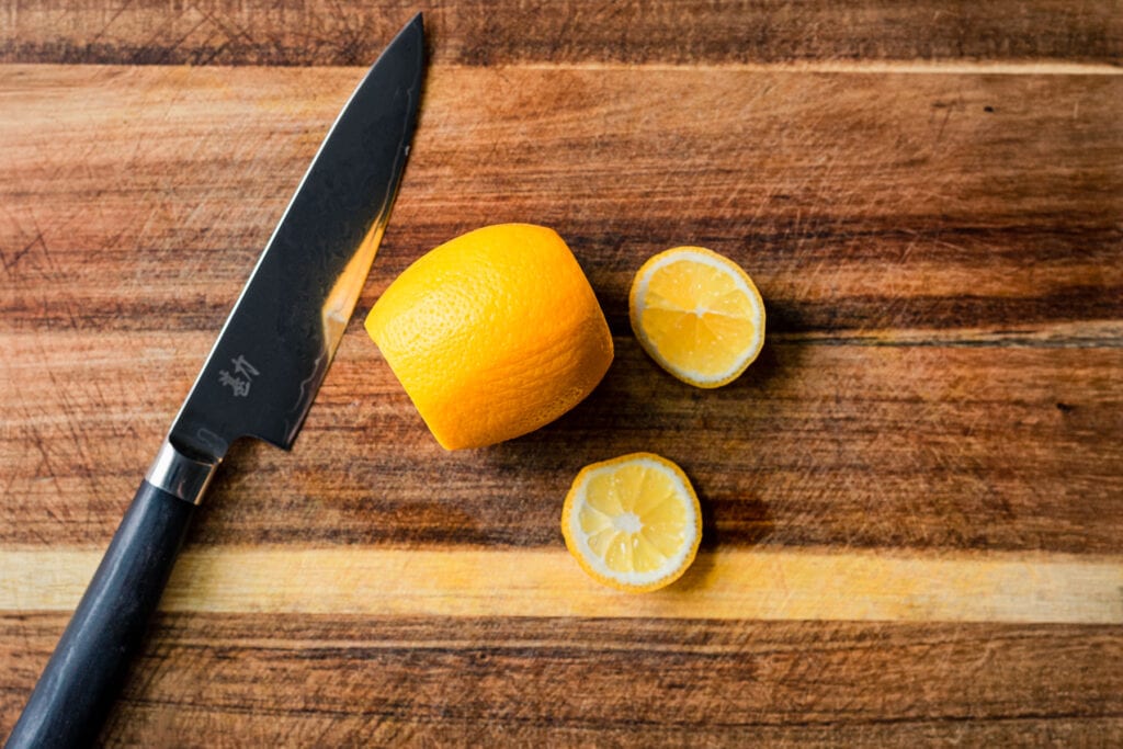 sliced lemon on cutting board