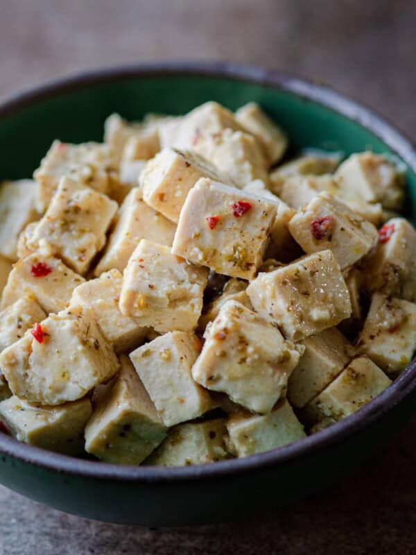 tofu feta in green bowl.