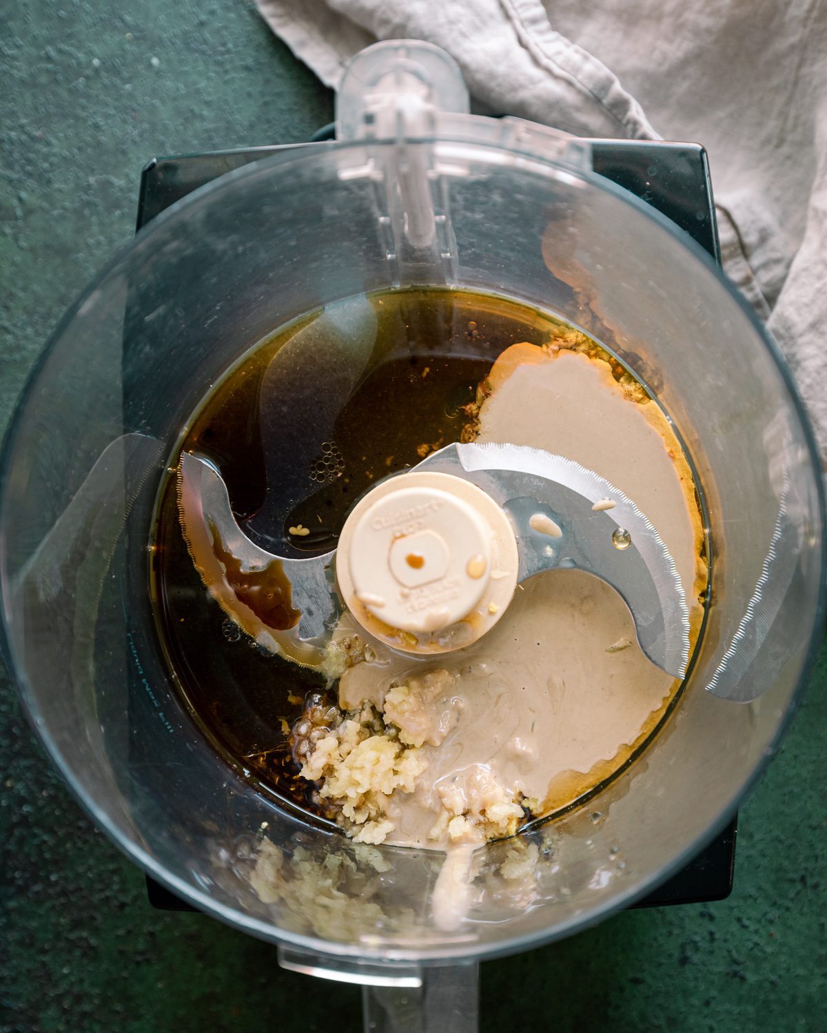 ingredients for ginger tahini dressing in food processor