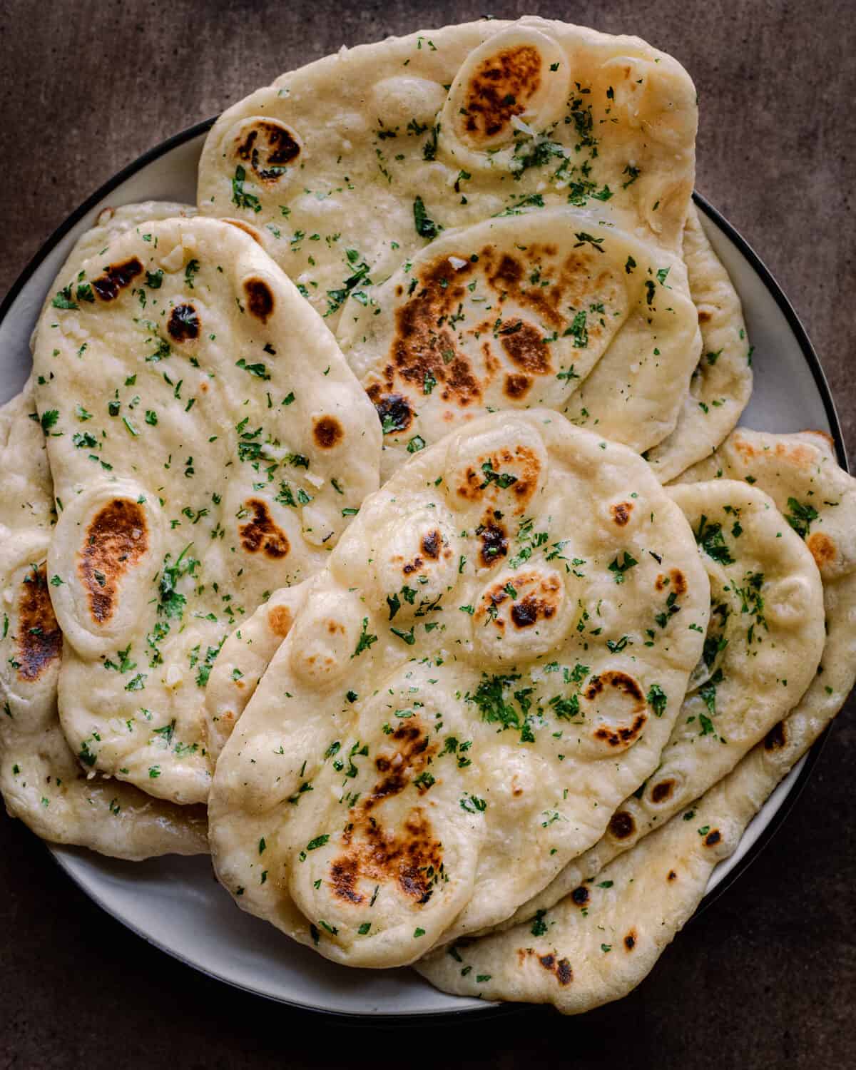 fluffy vegan naan sitting on a plate