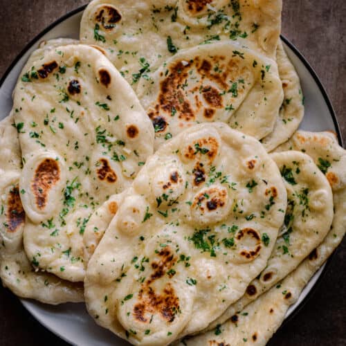 fluffy vegan naan sitting on a plate.