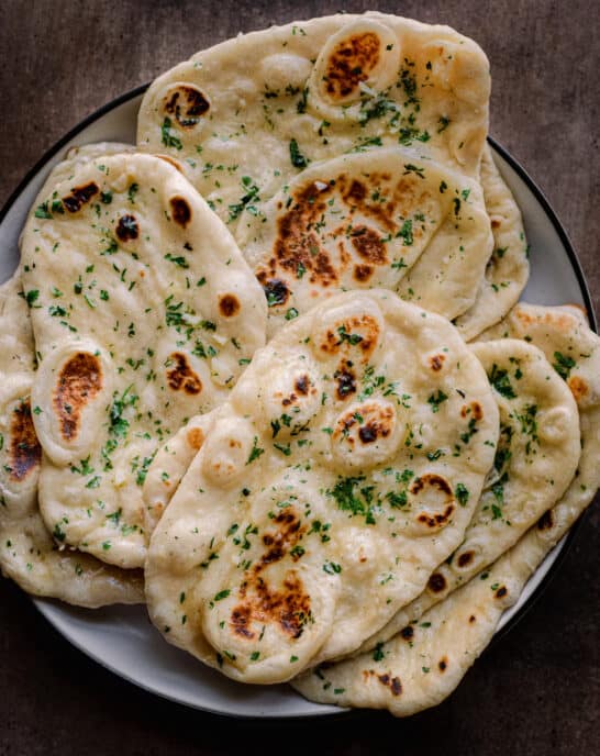 fluffy vegan naan sitting on a plate.