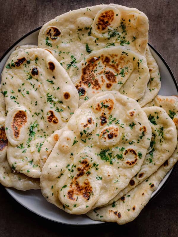 fluffy vegan naan sitting on a plate.