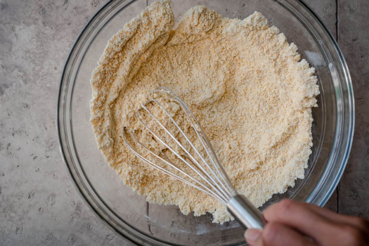 whisking cornmeal and flour