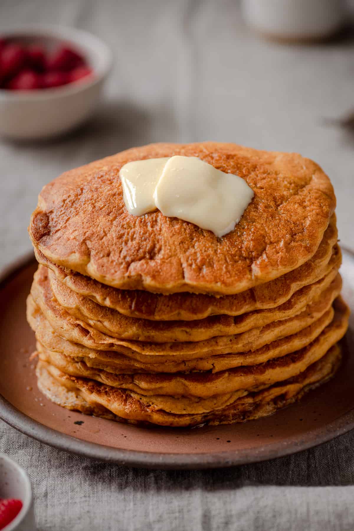 https://rainbowplantlife.com/wp-content/uploads/2021/10/vegan-pumpkin-pancakes-with-butter-on-top.jpg