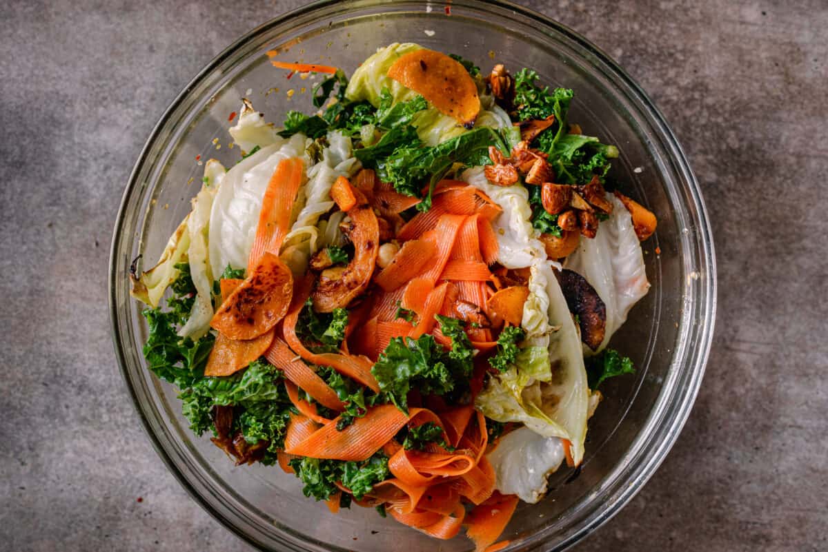 tossed kale and carrot salad with butternut squash and cabbage