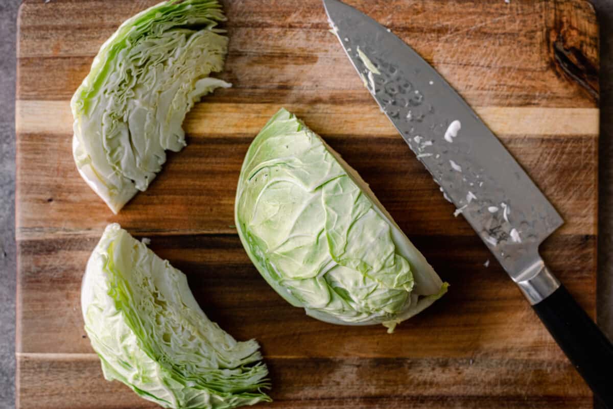 cabbage wedges on cutting board