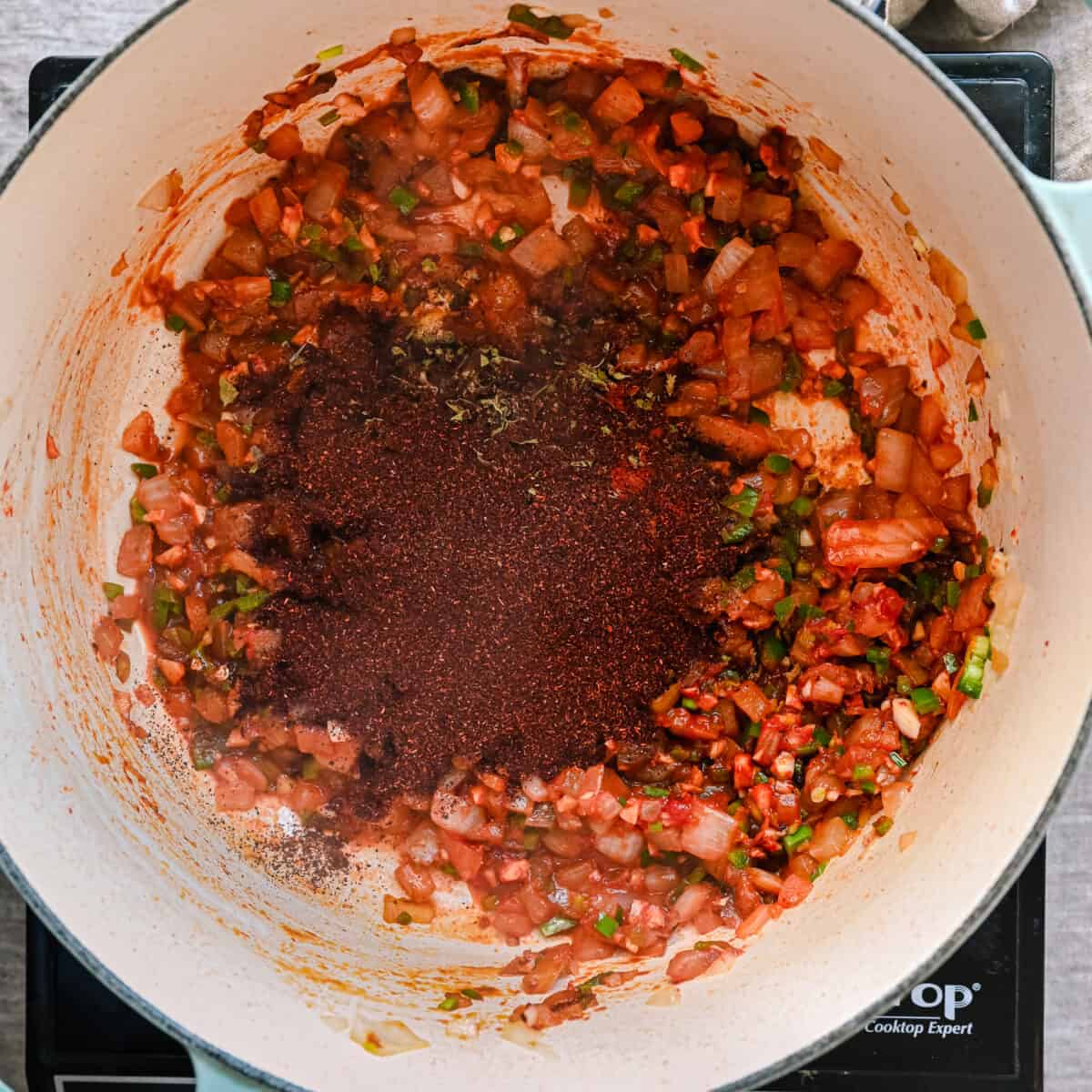 chili powder and spices added to aromatics