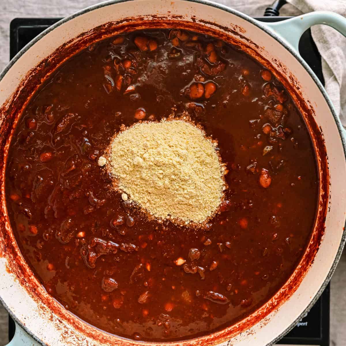 masa harina sitting on top of chili.