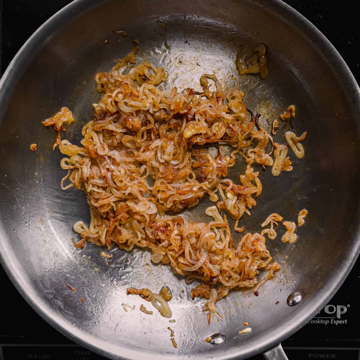 caramelized shallots in olive oil in a skillet