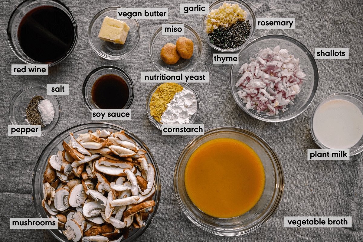 ingredients for vegan gravy on tablecloth with ingredients labeled