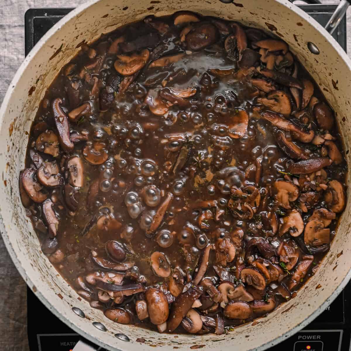 mushroom gravy simmering in skillet