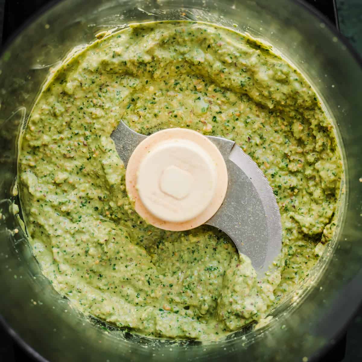 Pistachio pesto ingredients in a blender after being blended.