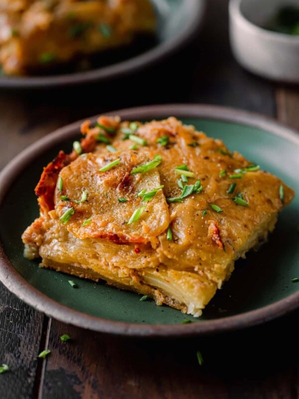 one square of scalloped potatoes on a small plate.