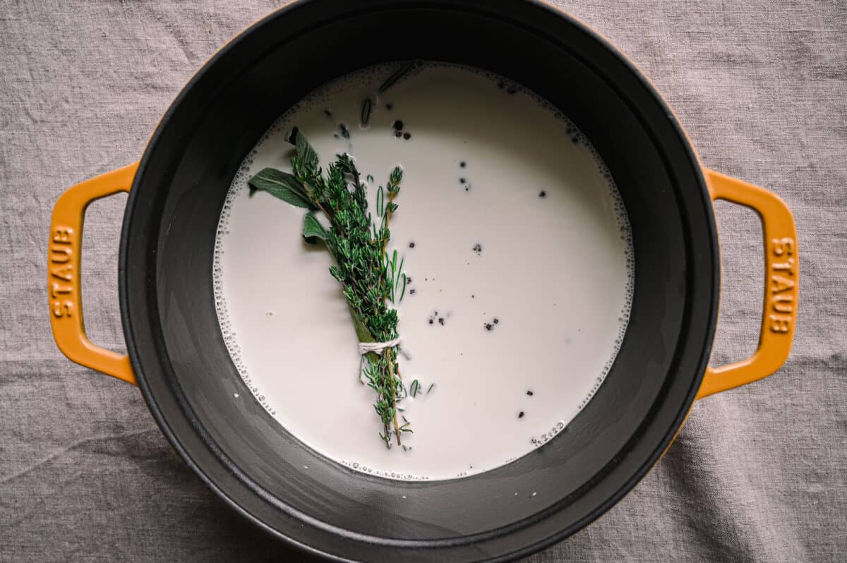 bouquet garni in a saucepan of plant-based milk