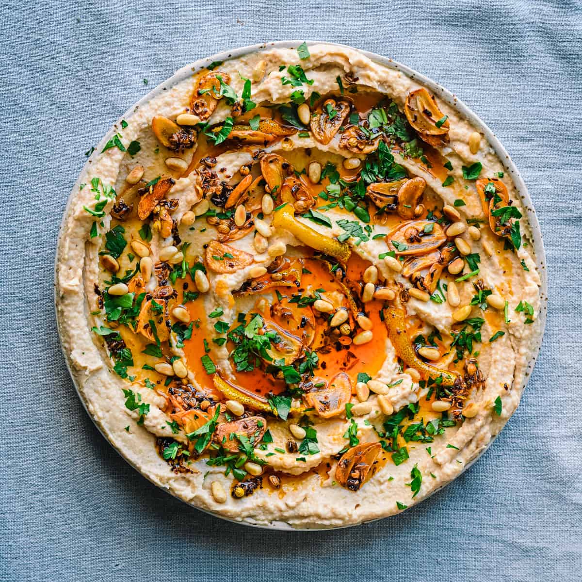 white bean dip with chili oil, garlic, parsley and pine nuts