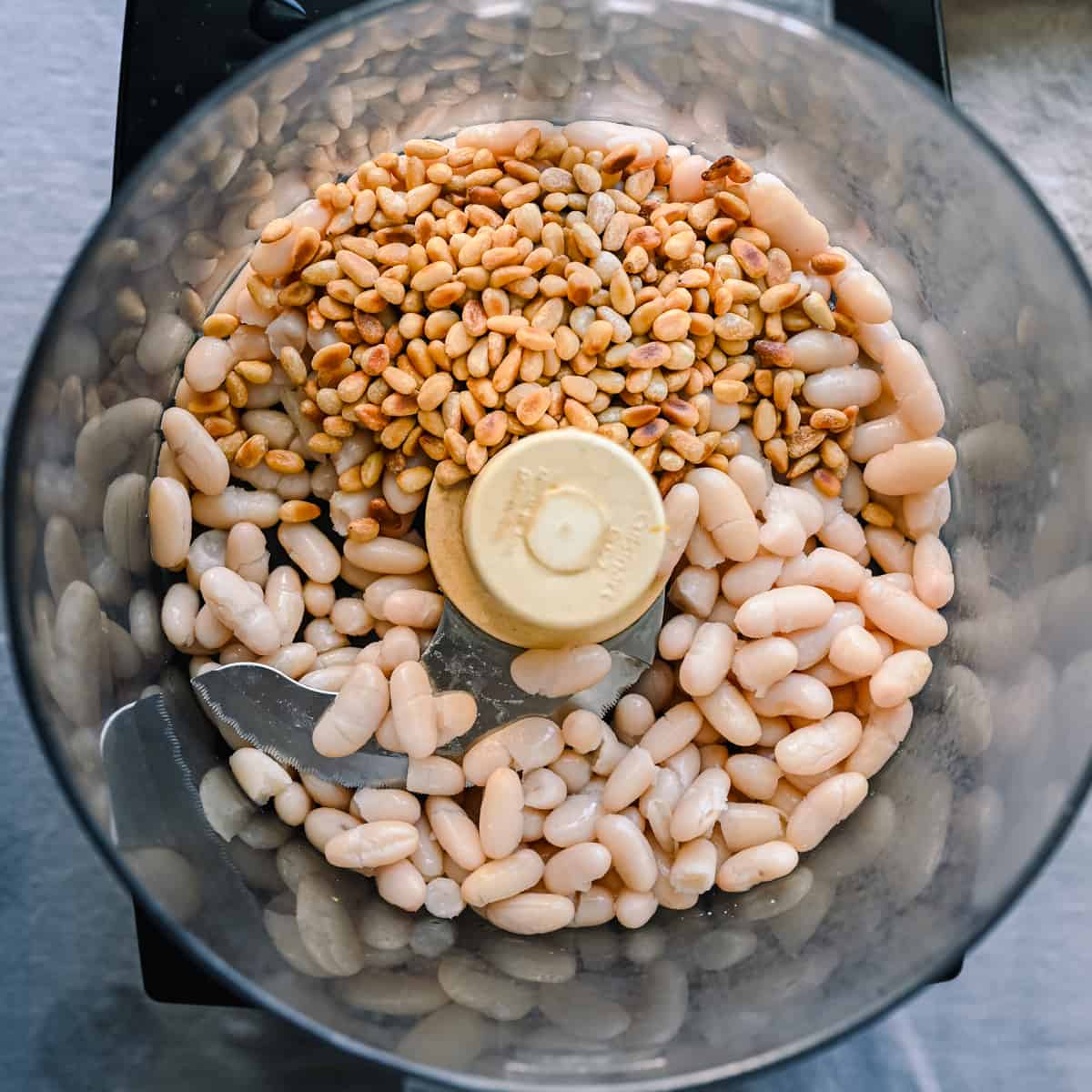 toasted white beans and cannellini beans in food processor