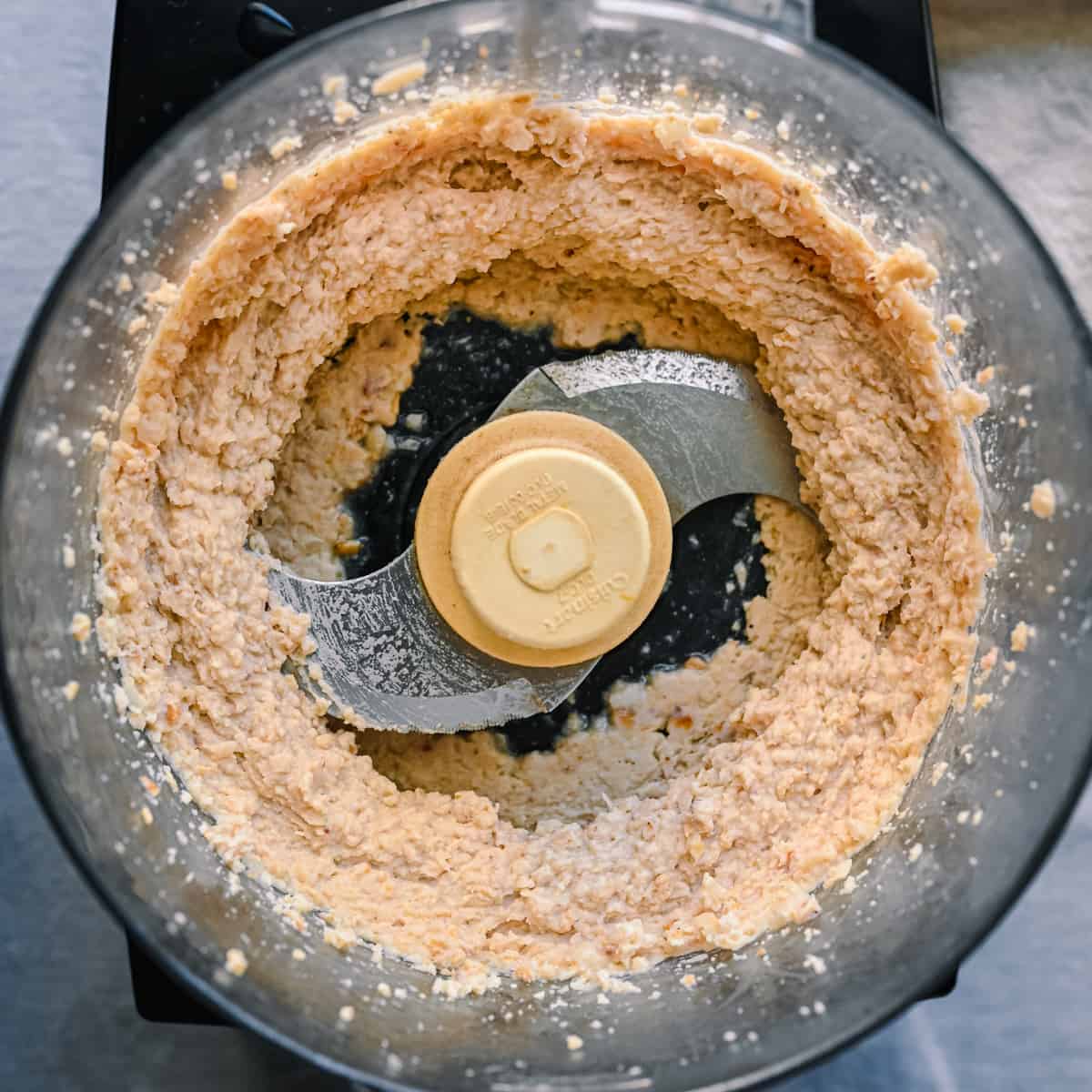 blending white bean dip in food processor