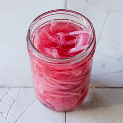 pickled onions in a jar.
