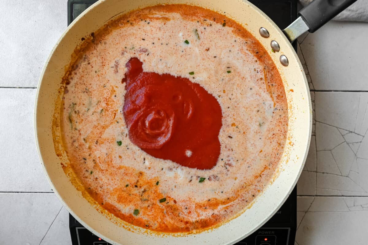 tomato sauce in an Indian curry in a frying pan