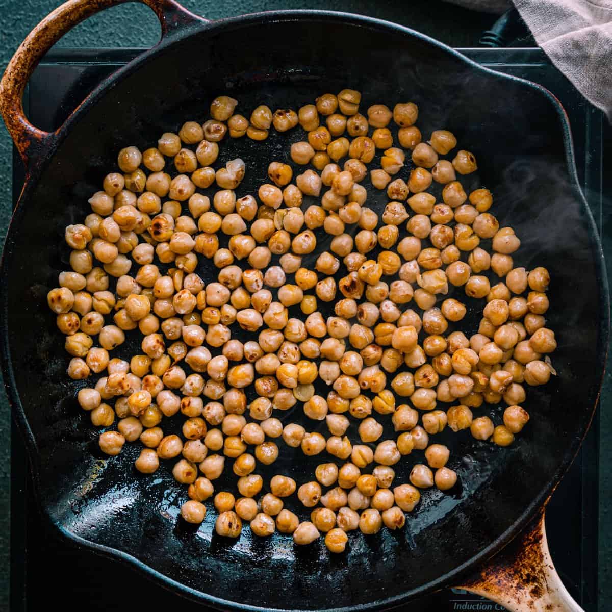 pan-frying chickpeas in a skillet