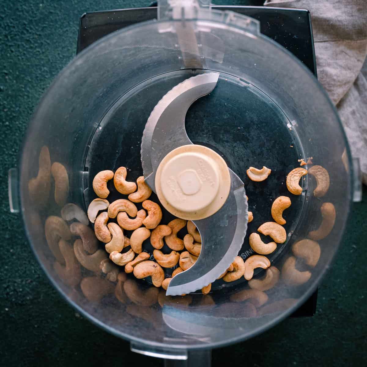 roasted cashews in a food processor