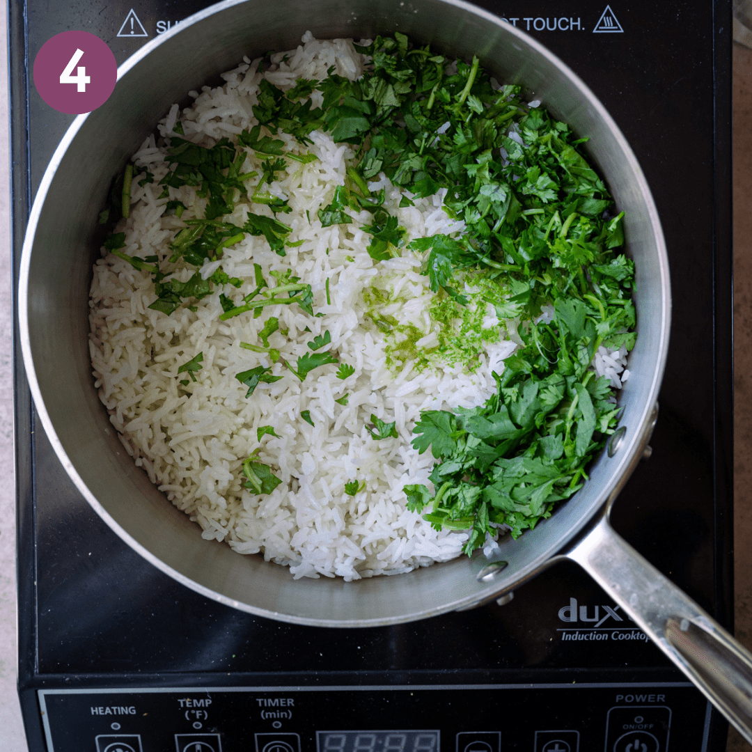 Cilantro added to white rice in pot.