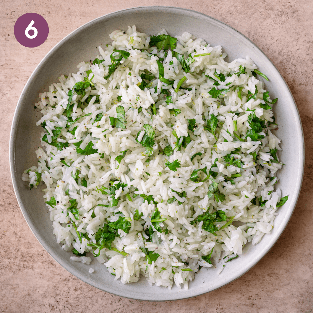 Cilantro lime rice on a white plate.