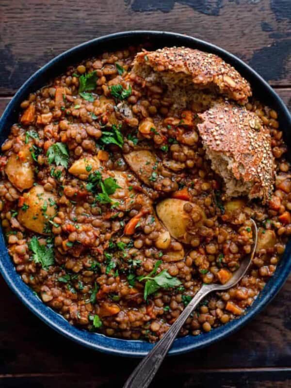bowl of instant pot lentil soup with bread.