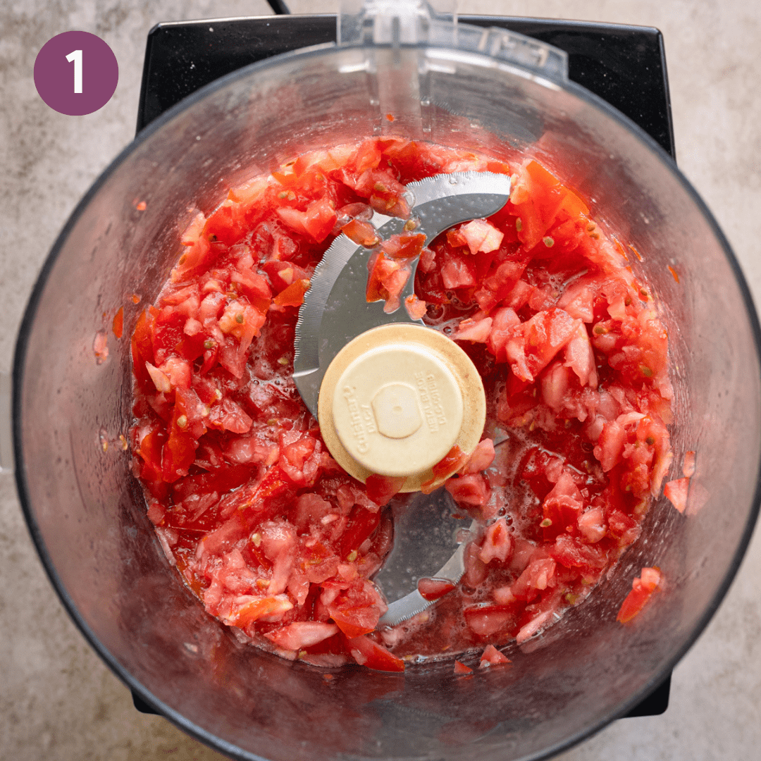 Fresh pureed tomatoes in a food processor.