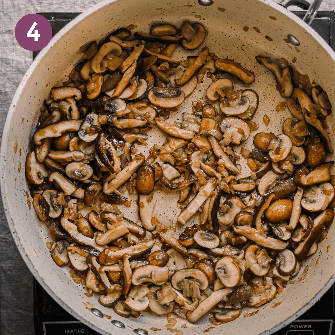 golden brown sauteed mushrooms in a ceramic saute pan.