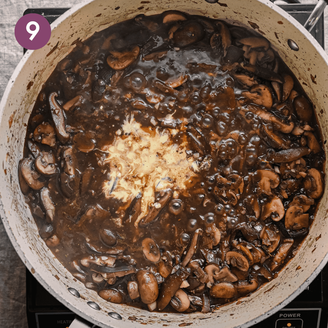 a roux poured into a vegan mushroom gravy to thicken it in a saute pan.