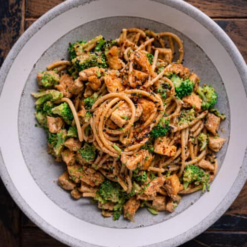 high protein tofu noodle bowl with almond butter sauce.