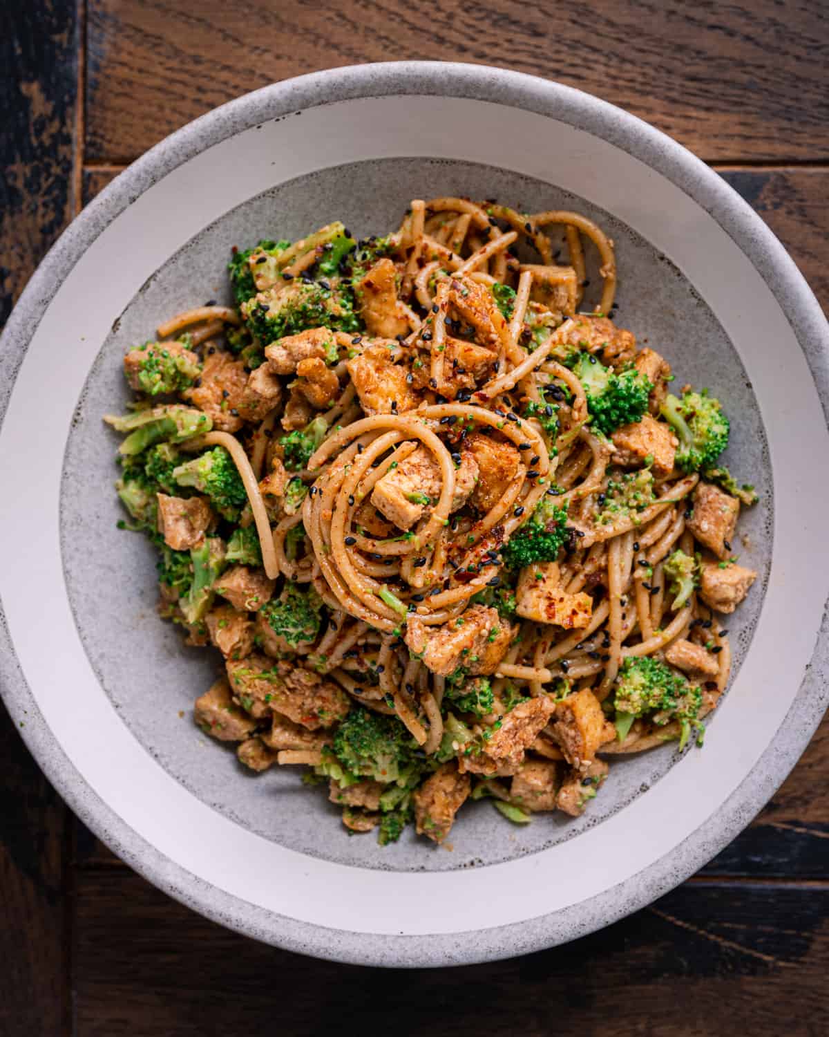 high protein tofu noodle bowl with almond butter sauce.